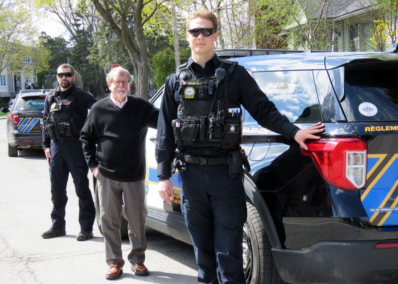 Hampstead Public Security standing in front of their vehicles with the Mayor